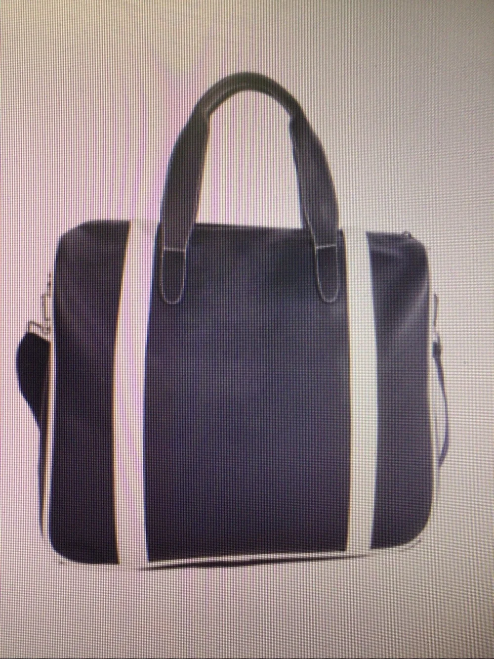 Dark blue PU leather handbag for short trips.